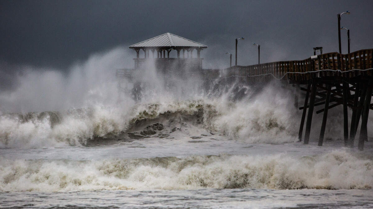Waves slam the Oceanana Pier in Atlantic Beach Thursday, Sept. 13, 2018 as Hurricane Florence approaches the Carolinas.