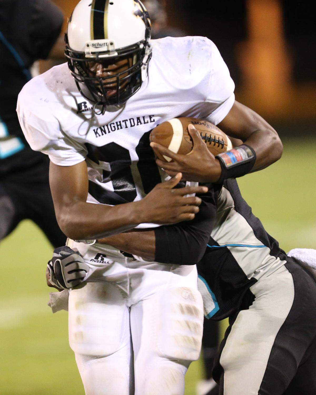 Knightdale’s Nate Harvey (38) runs hard during Knightdale’s football game against West Johnston High School, Friday, September 27, 2013 in Benson, NC