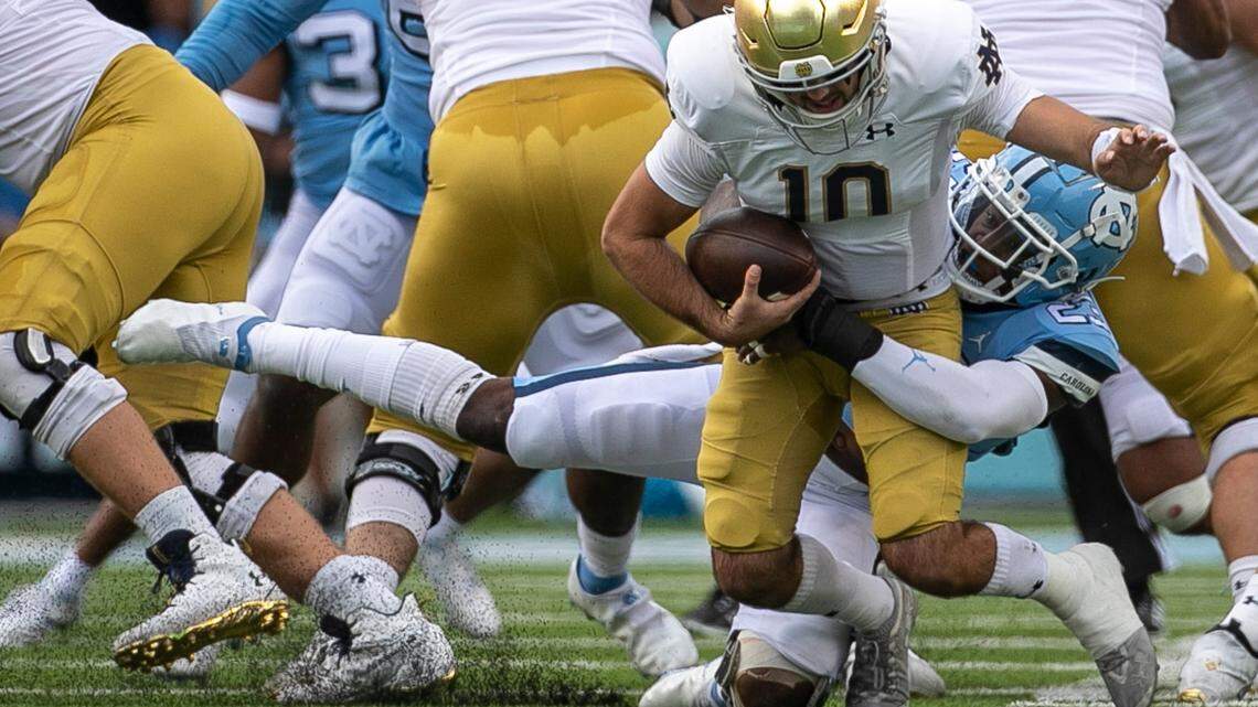 North Carolina’s Power Echols (23) sacks Notre Dame quarterback Drew Pyne (10) in the first quarter on Saturday, September 24, 2022 at Kenan Stadium in Chapel Hill, N.C.