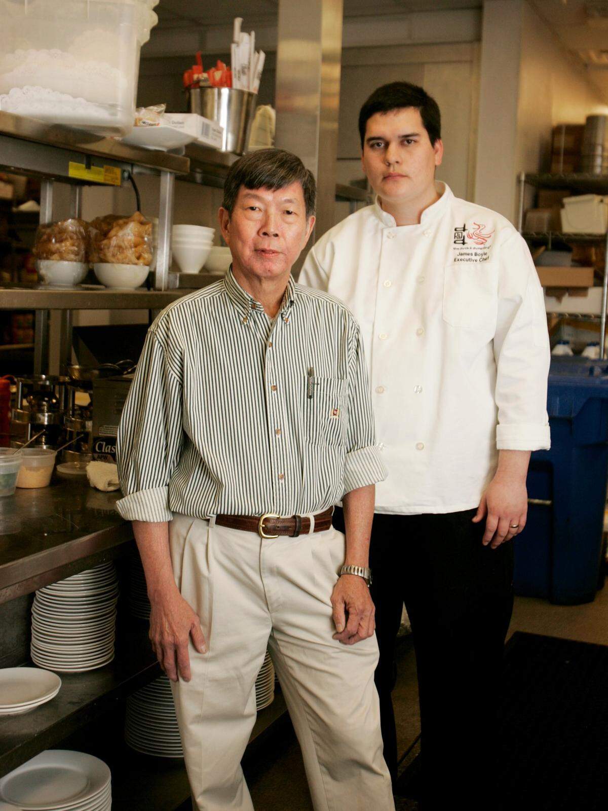 David Mao, left, has trained James Boyle to replace him as chef at the Duck & Dumpling in Raleigh. JULI LEONARD - jleonard@newsobserver.com