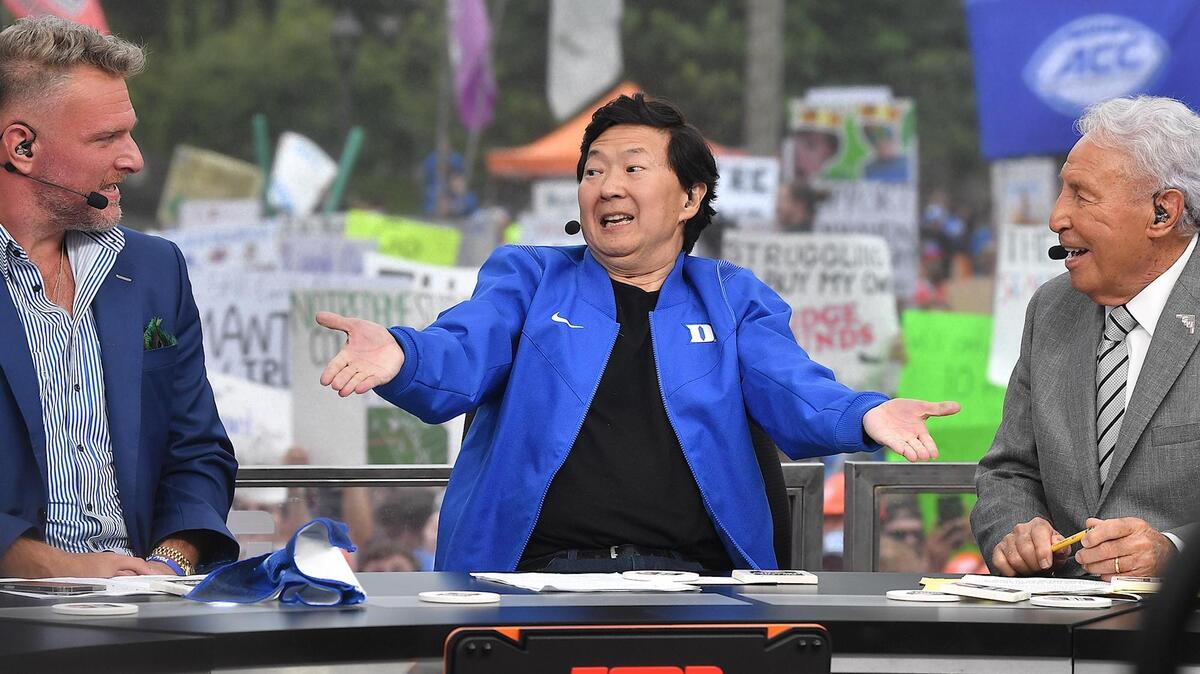 Duke graduate and actor /Comedian Ken Jeong makes his football predictions with ESPN GameDay analysts Pat MCafee , left, and Lee Corso. ESPN’s College football pregame show, GameDay, was held at Duke University in Durham, N.C. on September 30, 2023.