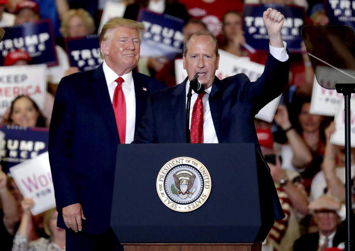 Then-President Donald Trump, left, gives his support to Dan Bishop, right, a Republican who was running for the special North Carolina 9th District U.S. Congressional race as he speaks at a rally in Fayetteville, N.C., Monday, Sept. 9, 2019.
