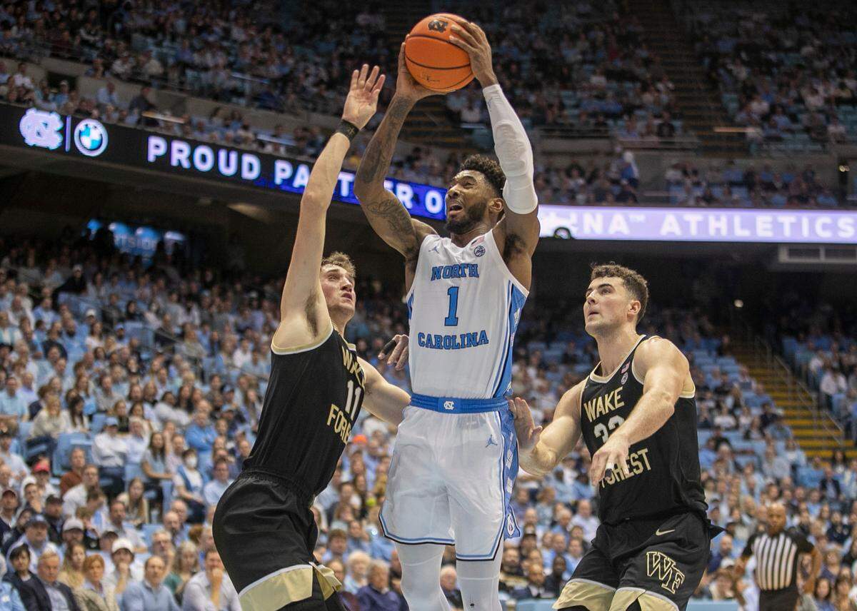 North Carolina’s Leaky Black (1) drives to the basket against Wake Forest’s Andrew Carr (11) during the first half on Wednesday, January 4, 2023 at the Smith Center in Chapel Hill, N.C.