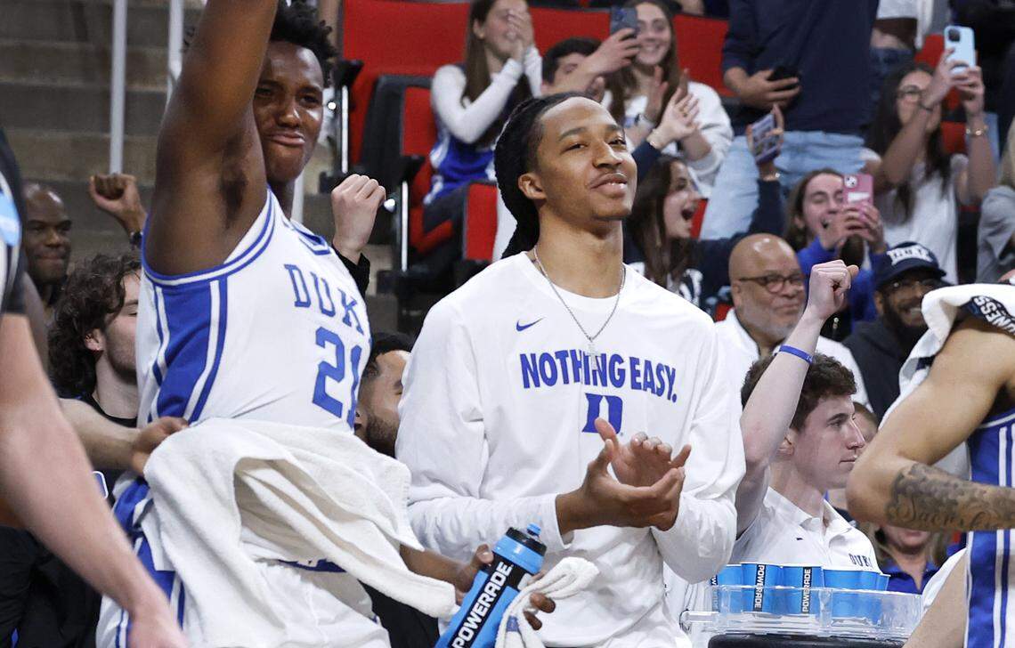 Duke’s Maliq Brown, center, and Patrick Ngongba II (21) celebrate after Spencer Hubbard made a basket in the second half of Duke’s 93-49 victory over Mount St. Mary’s in the first round of the 2025 NCAA Men’s Basketball Tournament at the Lenovo Center in Raleigh, N.C., Friday, March 21, 2025.