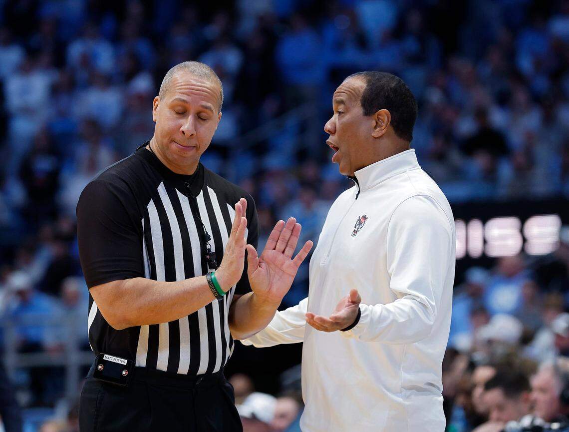 N.C. State head coach Kevin Keatts speaks with an official during the first half of the Wolfpack’s 97-73 loss to North Carolina on Wednesday, Feb. 19, 2025, at the Smith Center in Chapel Hill, N.C. 