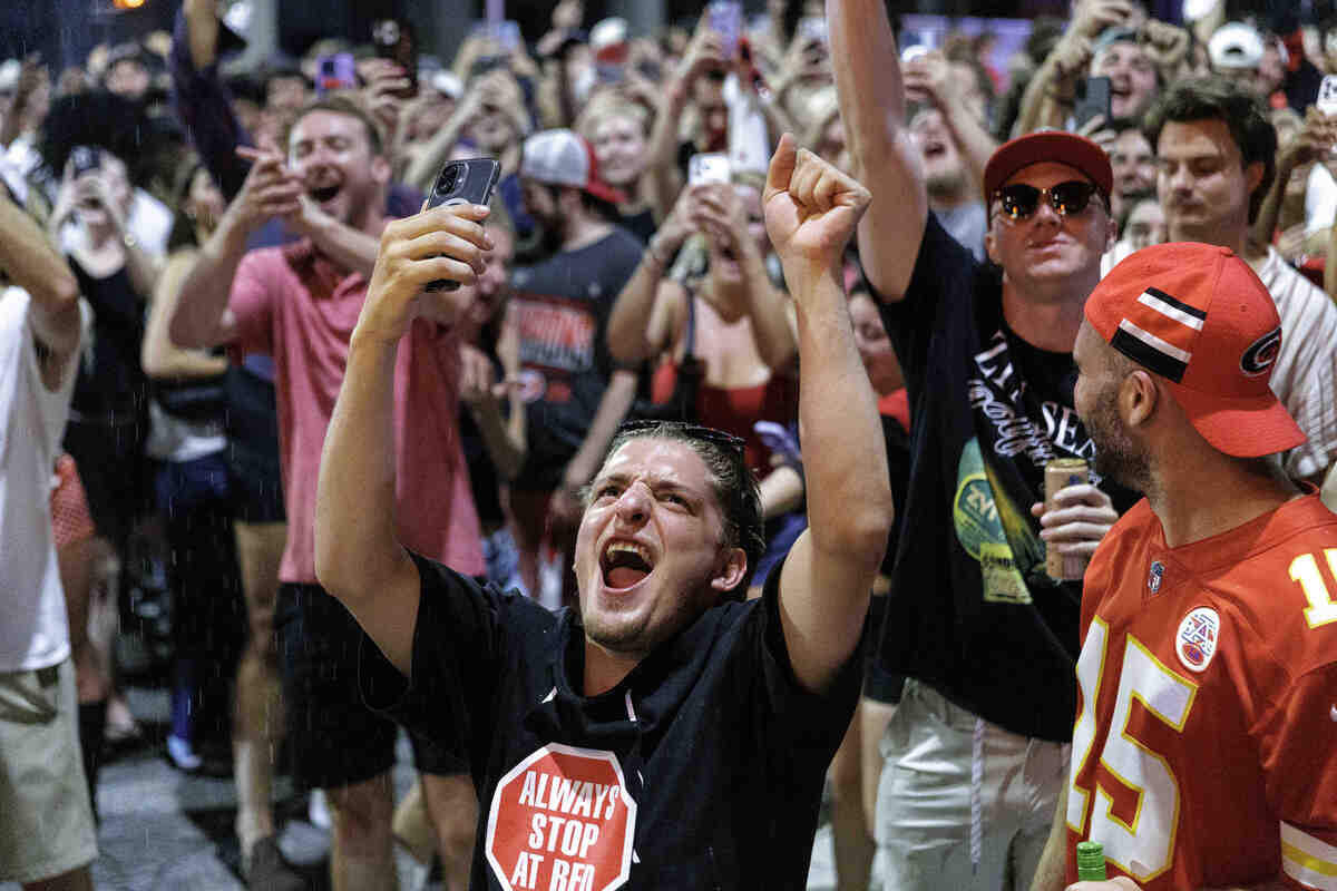 Bystanders recorded videos as fans celebrated in the streets after the Carolina Hurricanes won their second Stanley Cup in Glenwood South District on June 14, 2026, in Raleigh, North Carolina. The Hurricanes last won the Stanley Cup in 2006.