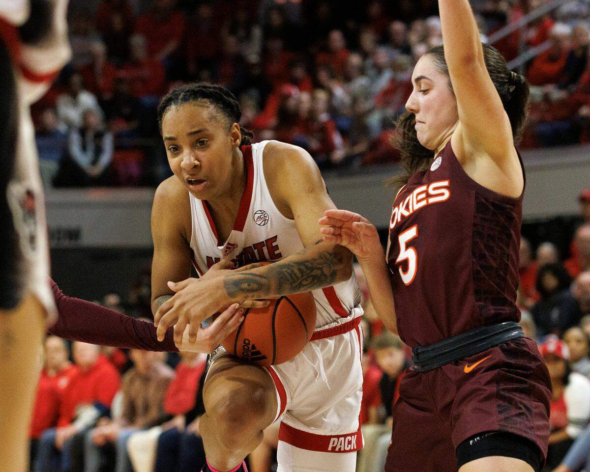 N.C. State’s Aziaha James drives against Virginia Tech’s Georgia Amoore during the second half of the Wolfpack’s 72-61 loss on Thursday, Feb. 8, 2024, at Reynolds Coliseum in Raleigh, N.C.