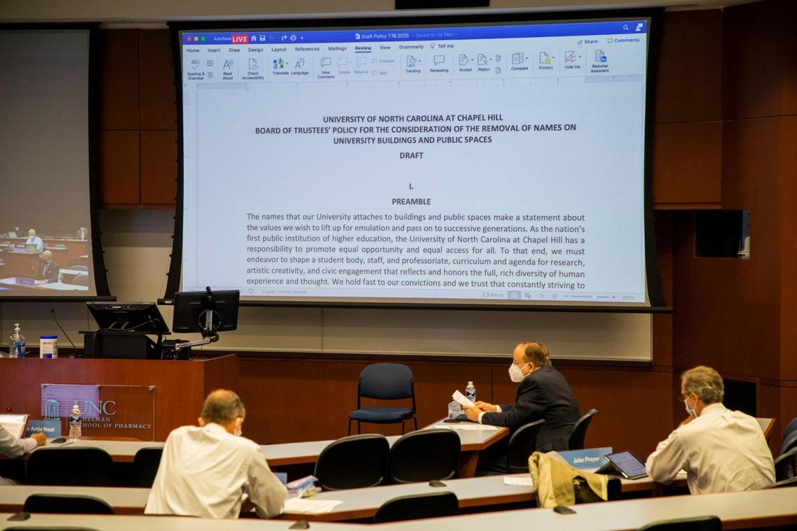 Members of the UNC Board of Trustees review the draft of a new policy for renaming campus buildings during their meeting on Thursday, July 16, 2020, in Chapel Hill, N.C. They also voted to remove the names from the Daniels Building, Carr Building, Ruffin Residence Hall and Aycock Residence Hall.