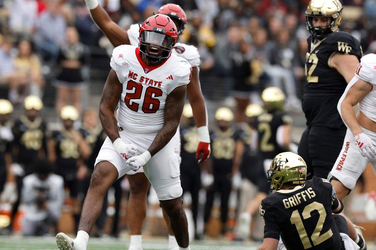 N.C. State linebacker Devon Betty (26) celebrates after sacking Wake Forest quarterback Mitch Griffis (12) during the Wolfpack’s victory over Wake Forest at Allegacy Stadium in Winston-Salem, N.C., Saturday, Nov. 11, 2023.