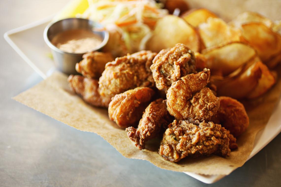 If it’s Southern comfort, Carolina style, that you’re craving, look no further than the Cedar Island Fry at Postal Fish Company in Pittsboro. Catfish, oysters and jumbo shrimp, all perfectly cooked in a light, crisp breading, are piled onto a parchment paper-lined plate with hushpuppies, house-made potato chips  and crunchy icebox slaw.