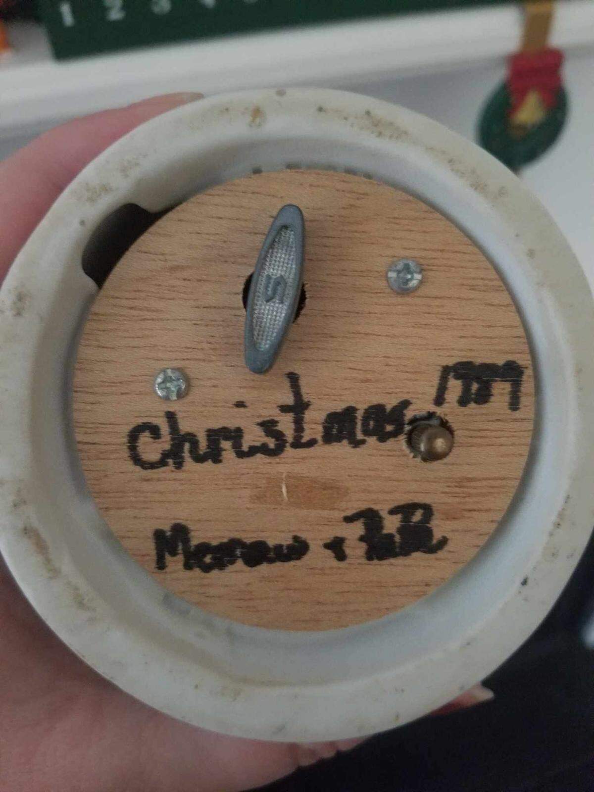 Anna Johnson’s Santa music box bears an inscription on its base, a reminder of her grandparents.