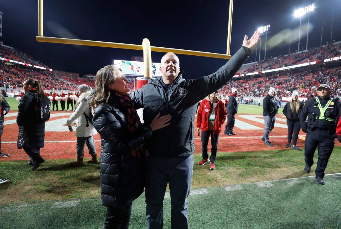 N.C. State head coach Dave Doeren and his wife Sara thank the crowd after the Wolfpack’s 39-20 victory over UNC at Carter-Finley Stadium in Raleigh, N.C., Saturday, Nov. 25, 2023.