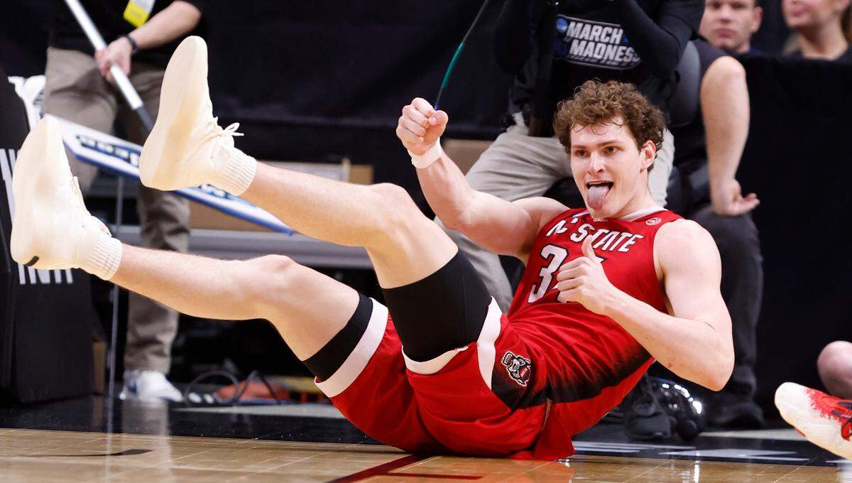 N.C. State’s Ben Middlebrooks (34) celebrates after taking a charge during the second half of N.C. State’s 76-64 victory over Duke in their NCAA Tournament Elite Eight matchup at the American Airlines Center in Dallas, Texas, Sunday, March 31, 2024.