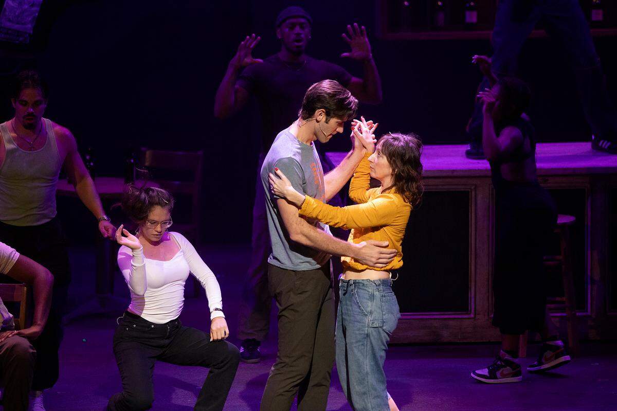 John Behlmann, playing the role of Nuke, and Carmen Cusack, playing the role of Annie, dance during a rehearsal of “Bull Durham” the musical on Thursday, Sept. 12, 2024, at Reynolds Industries Theater on Duke University campus.