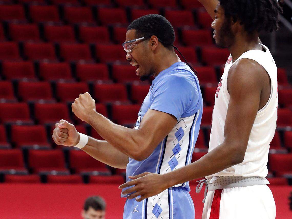 North Carolina’s Garrison Brooks (15) celebrates after being fouled while making the basket during the second half of N.C. State’s 79-76 victory over UNC at PNC Arena in Raleigh, N.C., Tuesday, December 22, 2020.