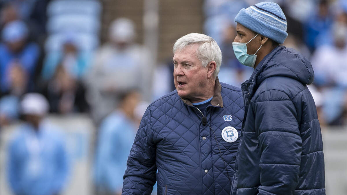 North Carolina coach Mack Brown talks with wide receiver Tylee Craft, who was recently diagnosed with a rare form of cancer, prior to the Tar Heels’ spring football game on Saturday, April 9, 2022 at Kenan Stadium in Chapel Hill, N.C. The spring game was named in Tylee’s honor.