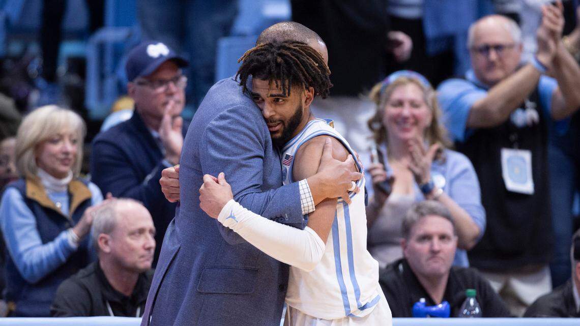 North Carolina coach Hubert Davis embraces R.J. Davis (4) as he comes out the game in the final minute of play after scoring a career high 36 points in the Tar Heels’ 85-64 victory over Wake Forest on Monday, January 22, 2024 at the Smith Center in Chapel Hill, N.C.