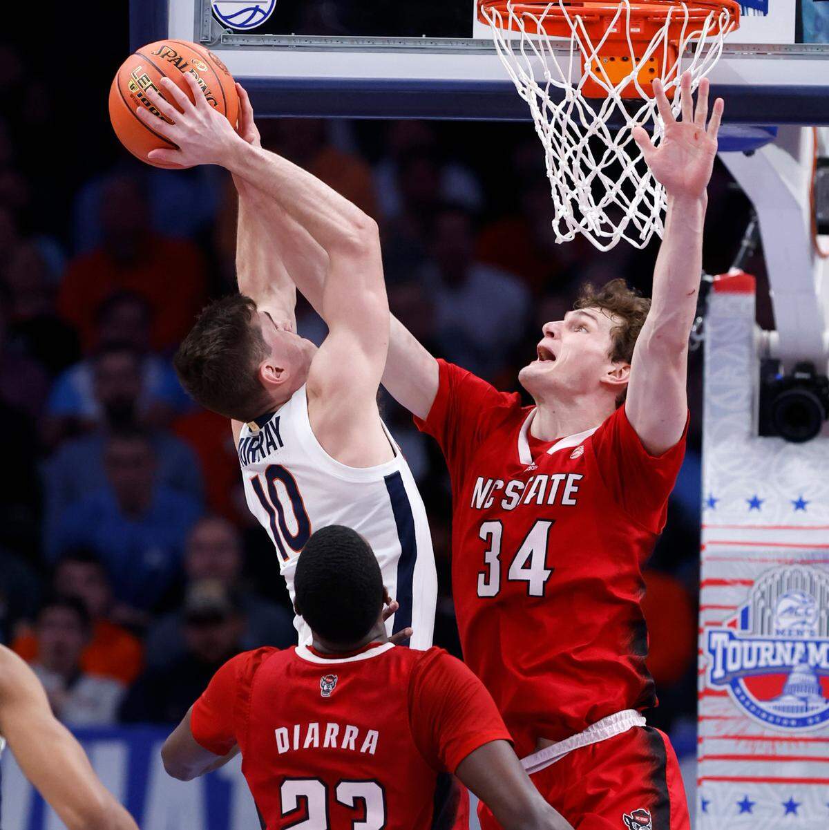 N.C. State’s Ben Middlebrooks (34) blocks the shot by Virginia’s Taine Murray (10) during the second half of N.C. State’s 72-65 overtime victory over Virginia in the semifinals of the 2024 ACC Men’s Basketball Tournament at Capital One Arena in Washington, D.C., Friday, March 15, 2024.