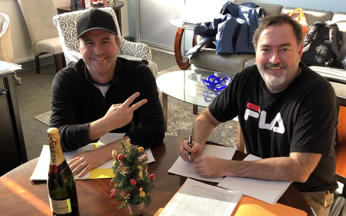 Fred Toucher, right, and Rich Shertenlieb after re-signing with 98.5 in December 2018.