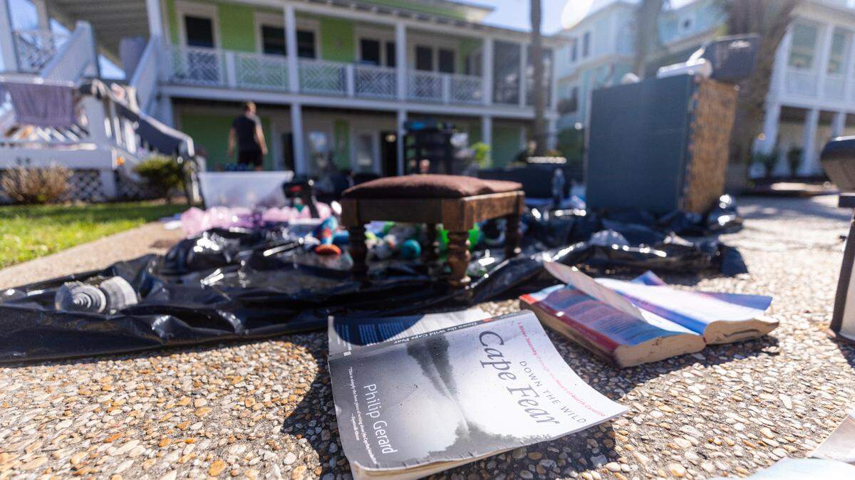 The contents of Shanda Rickert’s Kure Beach flooded ground-level apartment dry in the sun on Tuesday, Sept. 17, 2024 after an unnamed storm dropped as much as 18 inches of rain in southeastern North Carolina over a 72-hour period.