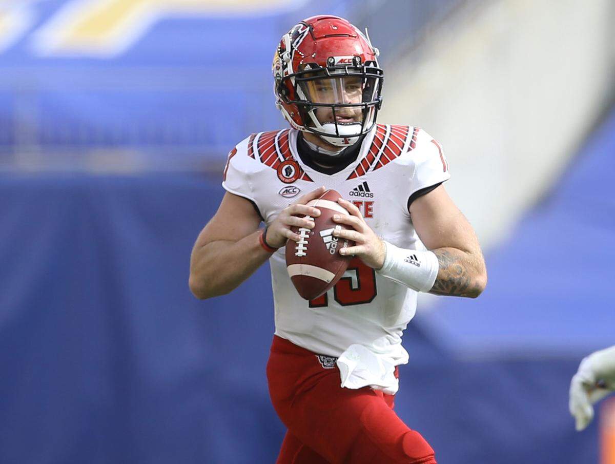 N.C. State quarterback Devin Leary (13) scrambles with the ball during the game against the Pittsburgh Panthers at Heinz Field Saturday, Oct. 3, 2020.