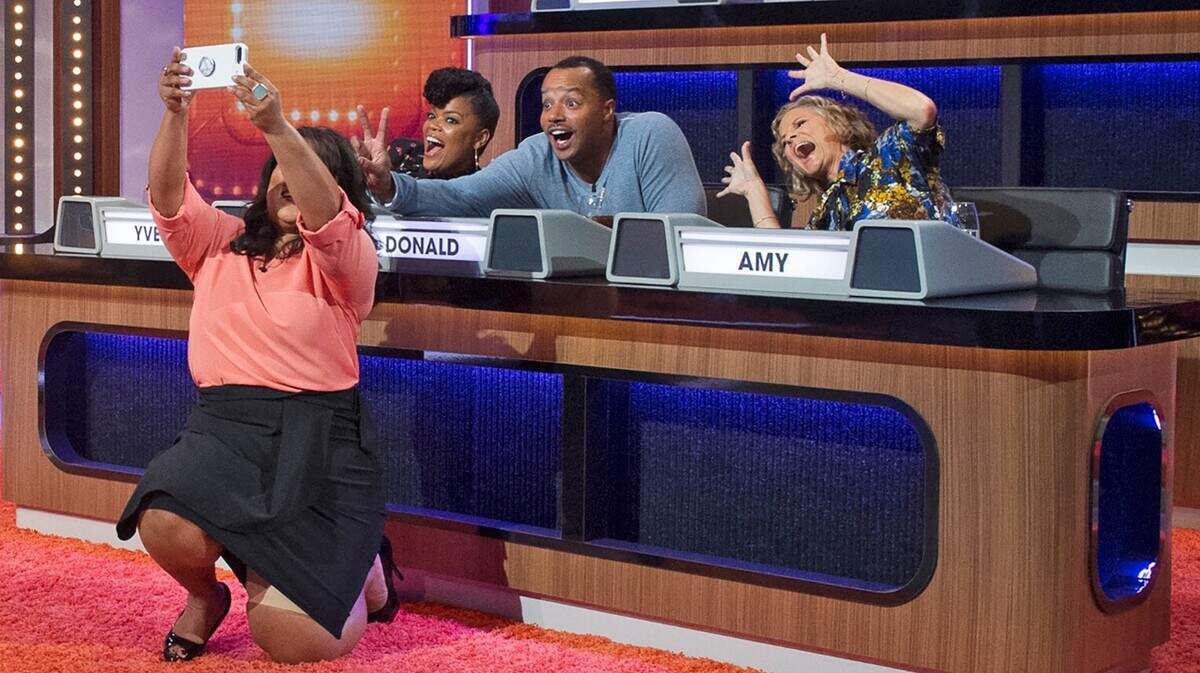 Contestant Dawn McNairy takes a selfie with Yvette Nicole Brown (left), Donald Faison (center) and Amy Sedaris.