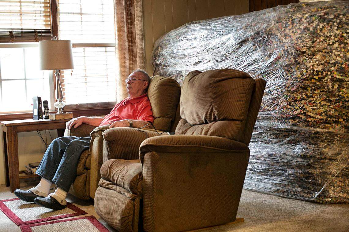 Butch Baker began making a paper chain in 1979. It is now more than 23 miles long takes up a corner of the living room of his home in Four Oaks, N.C. Baker works on the chain from an easy chair, and adds to the growing pile behind him every 100 yards. He was photographed on Friday, March 30, 2018.