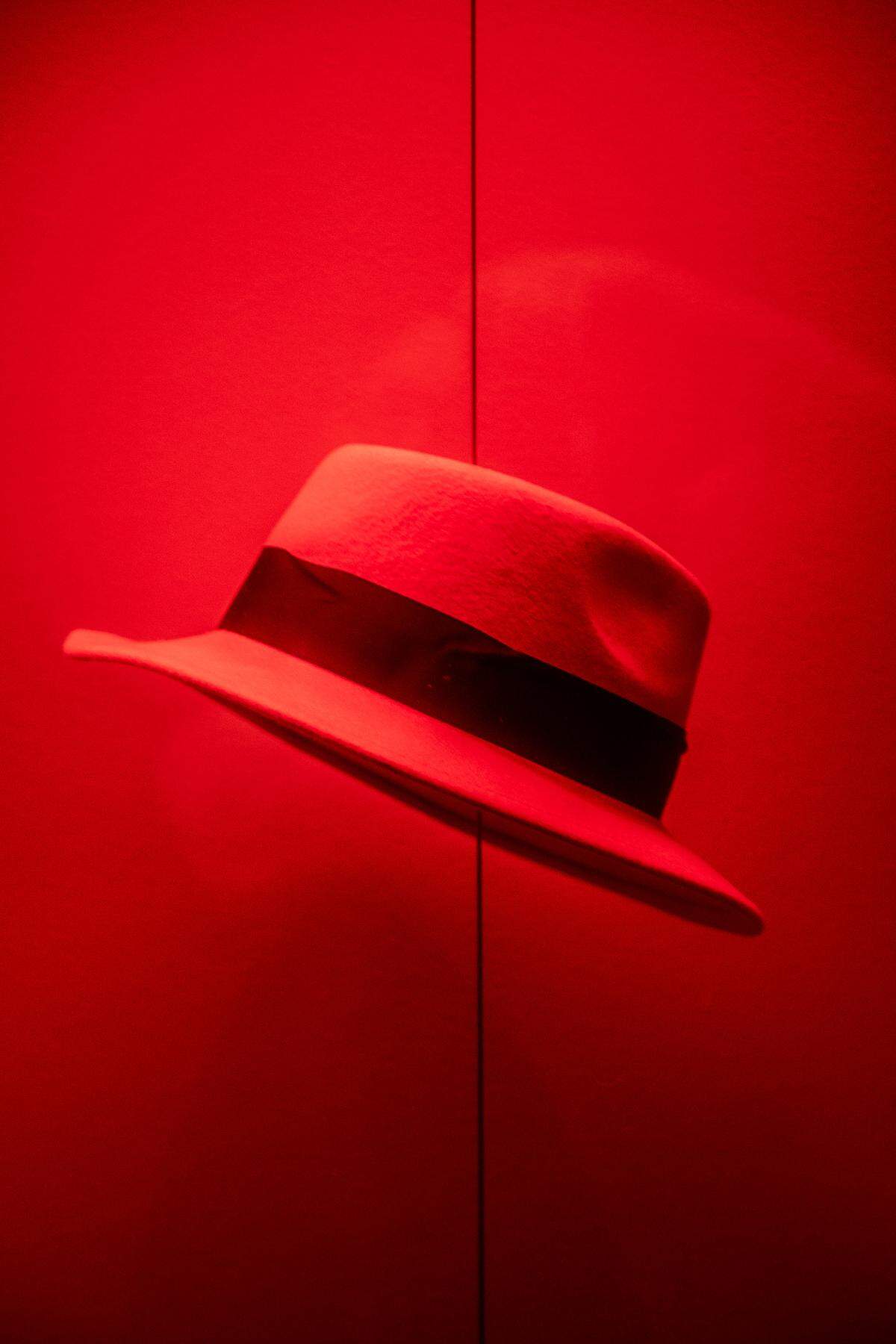 One of many red fedoras on display inside Red Hat’s office building in Raleigh.