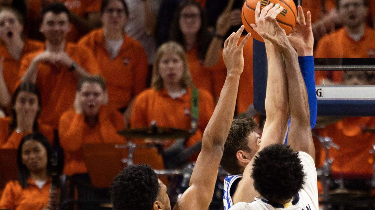 Duke’s Kyle Filipowski, back right, goes up for a basket while defended by Virginia’s Ryan Dunn (13) and Reece Beekman (2) during the second half of an NCAA college basketball game in Charlottesville, Va., Saturday, Feb. 11, 2023.