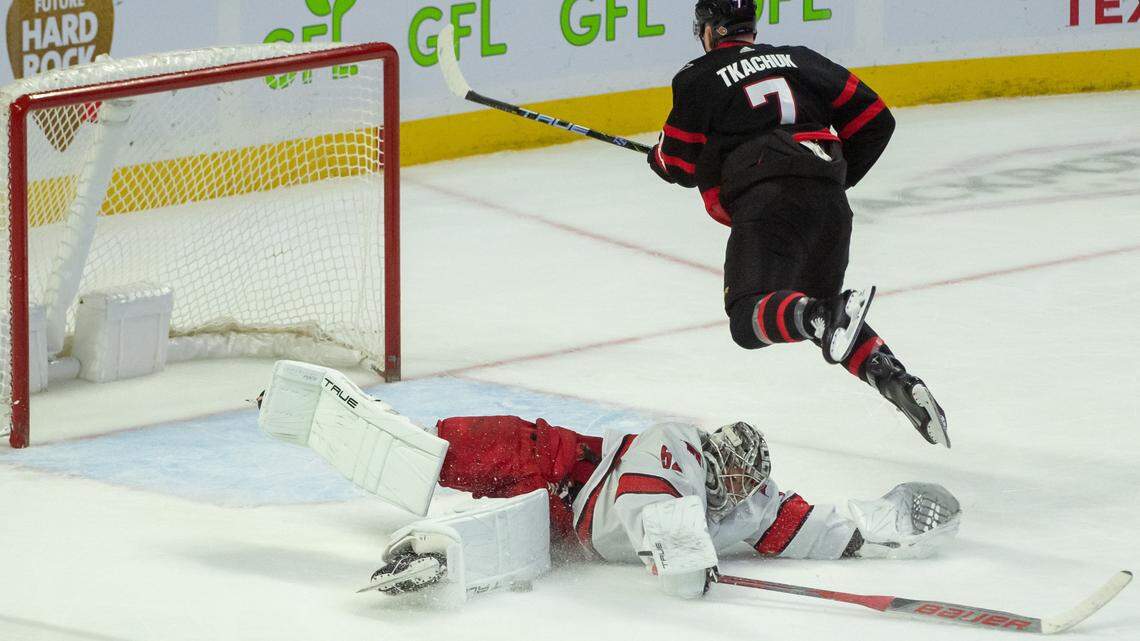 Dec 12, 2023; Ottawa, Ontario, CAN; Carolina Hurricanes goalie Pyotr Kochetkov (52) comes out of the crease to make a save on a penalty shot from Ottawa Senators left wing Brady Tkachuk (7) in the third period at the Canadian Tire Centre. Mandatory Credit: Marc DesRosiers-USA TODAY Sports.