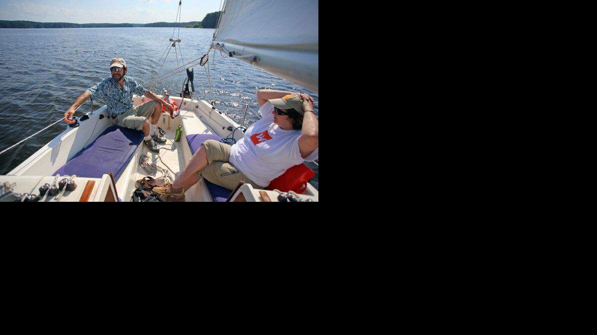 Pete Crawford and Katherine Smart sail their boat with a TillerClutch at Jordan Lake in Chatham County, on Friday, July 26, 2013.