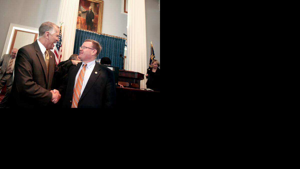 "Good job today," says Representative Tim Moore (Rep), right, to Speaker of the House Thom Tillis (Rep), left, after their session adjourned. Members of the N.C. House met in the old chambers in the N.C. State Capitol in Raleigh, N.C. on Thursday, May 22, 2014. They gathered in the historic room to celebrate its 220th anniversary. The space served the 120-member House of Commons from 1840-1868 and the House of Representatives from 1868-1961.
