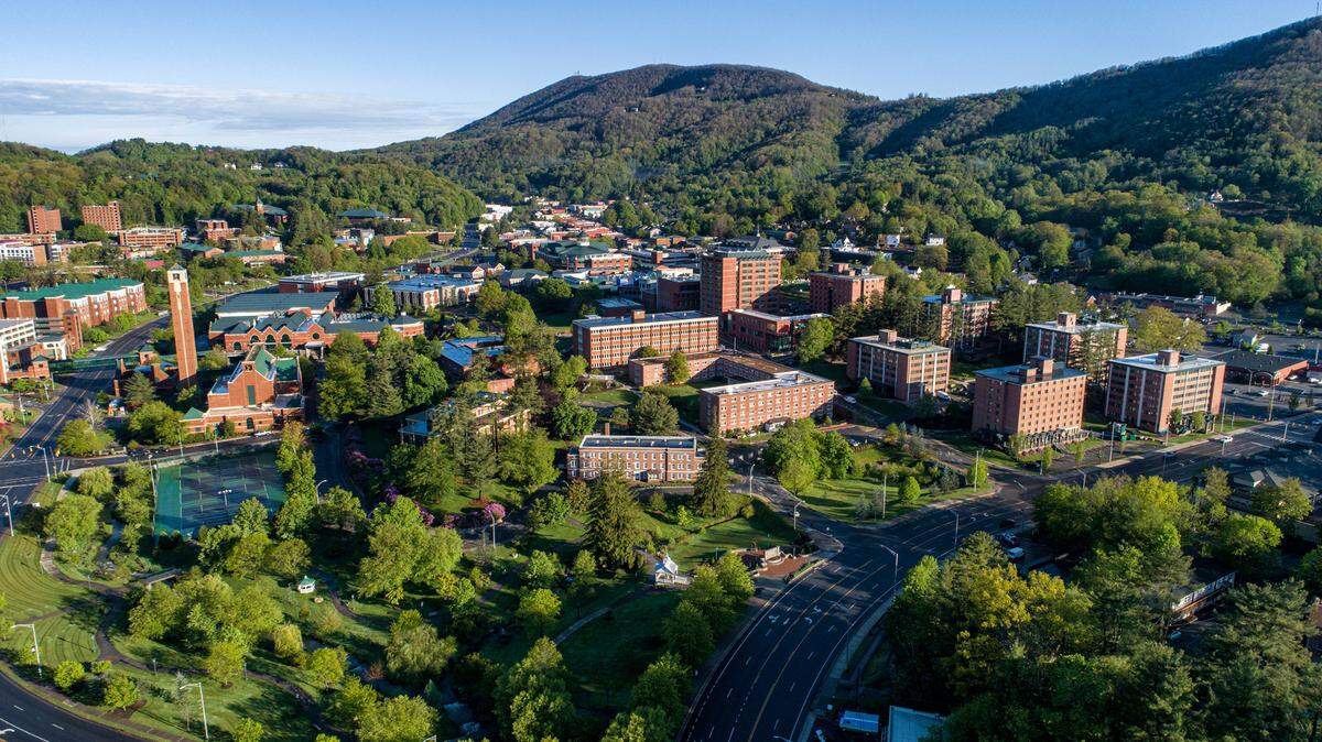 An Appalachian State University worker was arrested after a phone was found in a dorm bathroom, officials said.