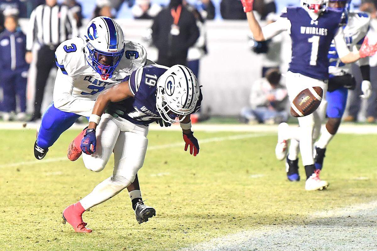 Clayton free safety Tashaun Walker (3) defends the pass to  Grimsley wide receiver Jordan Davis (19) during the second half.  The Clayton Comets and the Grimsley Whirlies met in the NCHSAA 7A football Championships in Chapel Hill, NC on December 12, 2025.