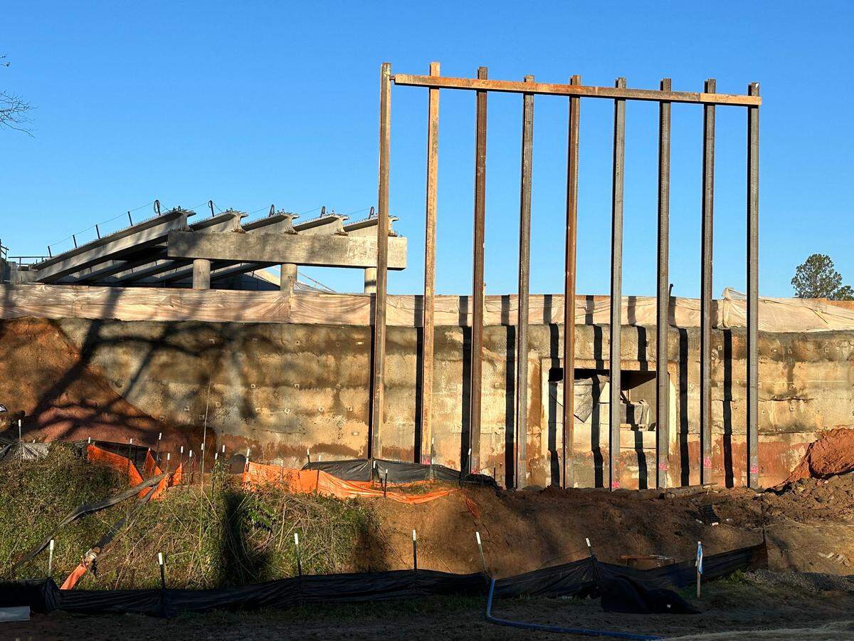 The east entrance to the old Ligon Street tunnel is visible behind the steel frame of the bridge that has now taken its place. Photo taken Feb. 24, 2024. 