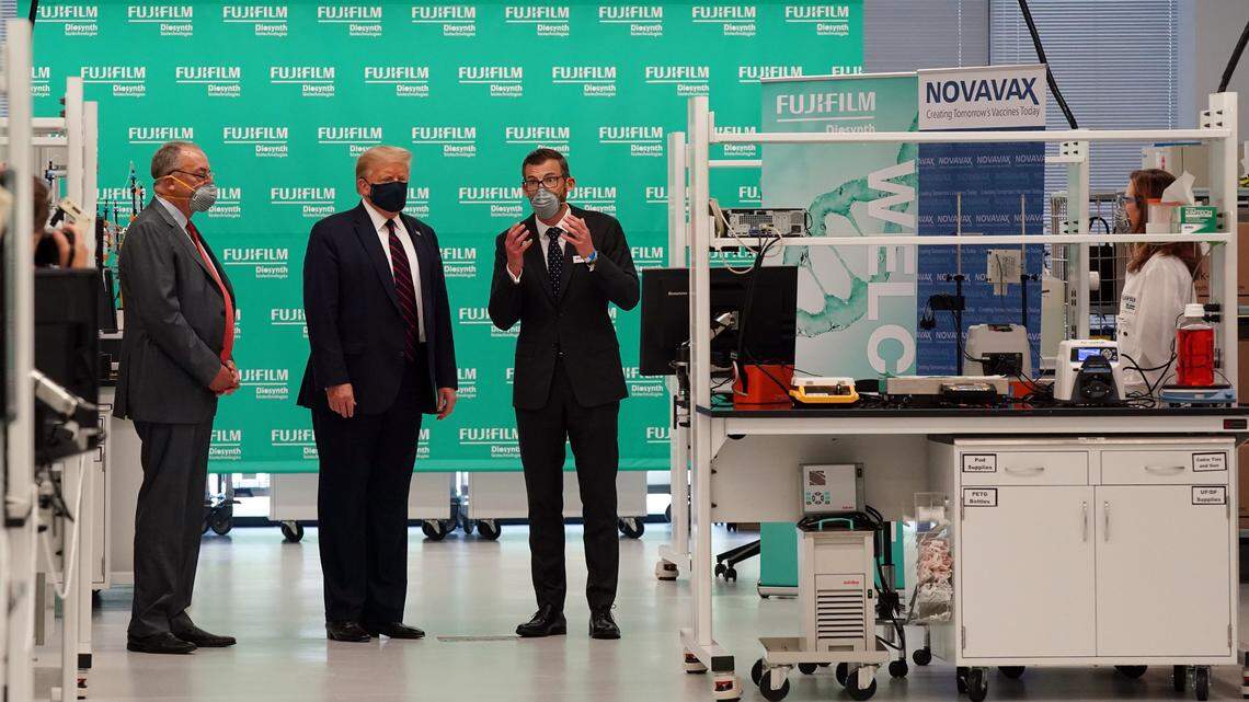 Fujifilm Diosynth CEO Martin Meeson, right, gives President Donald Trump a tour of the Bioprocess Innovation Center at Fujifilm Diosynth Biotechnologies in Morrisville, N.C., on Monday, July 27, 2020.