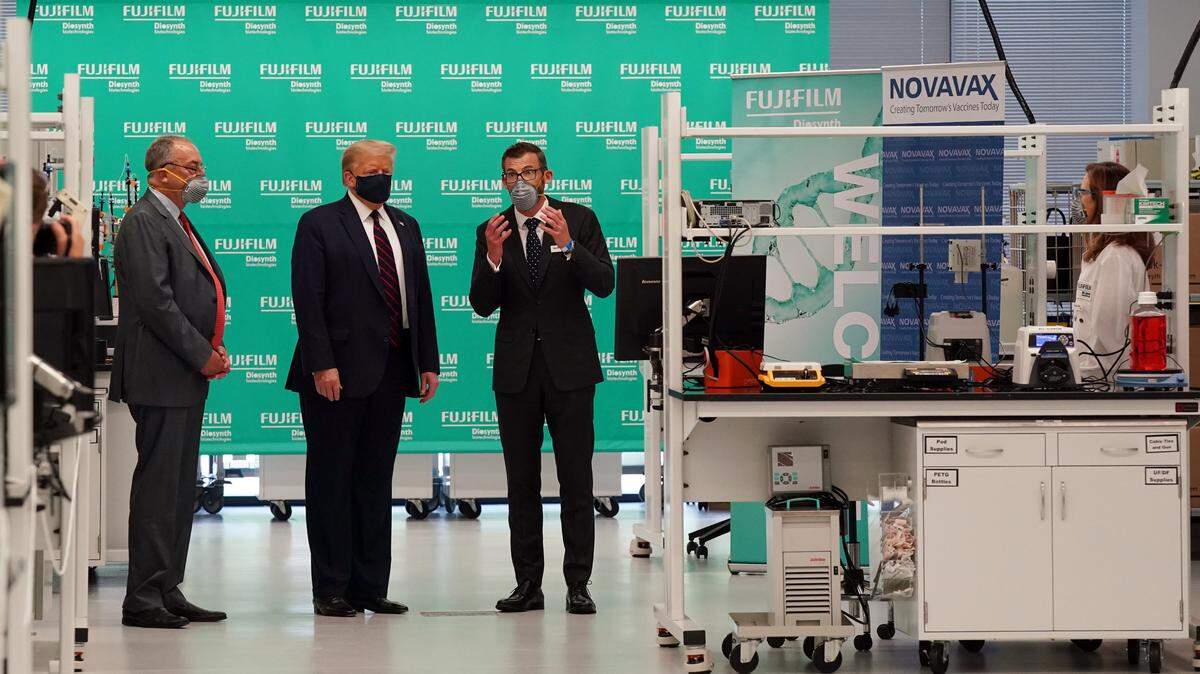 Fujifilm Diosynth CEO Martin Meeson, right, gives President Donald Trump a tour of the Bioprocess Innovation Center at Fujifilm Diosynth Biotechnologies in Morrisville, N.C., on Monday, July 27, 2020.