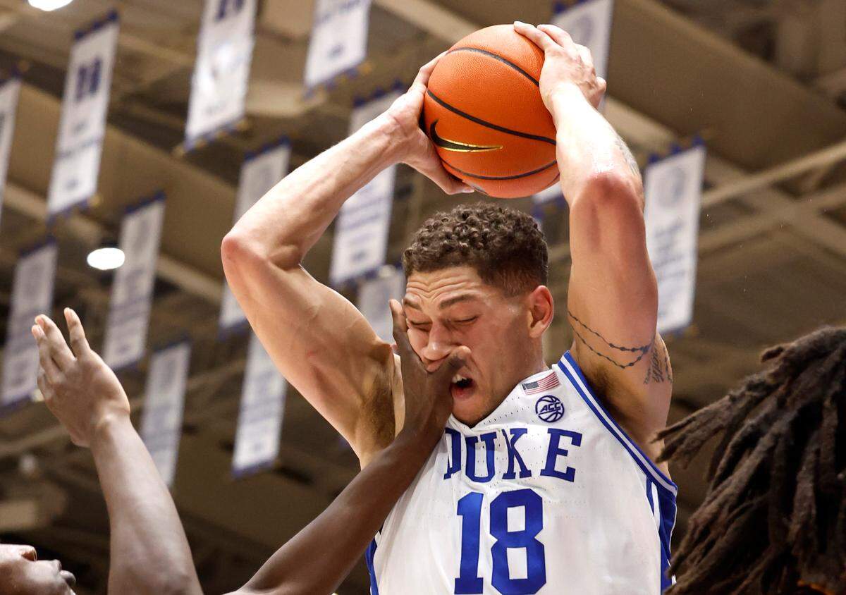 Duke’s Mason Gillis (18) pulls in the rebound while defended by Arizona State’s Joson Sanon (3) during the first half of Duke’s game against Arizona State in the Brotherhood Run Charity Game at Cameron Indoor Stadium in Durham, N.C., Sunday, Oct. 27, 2024.