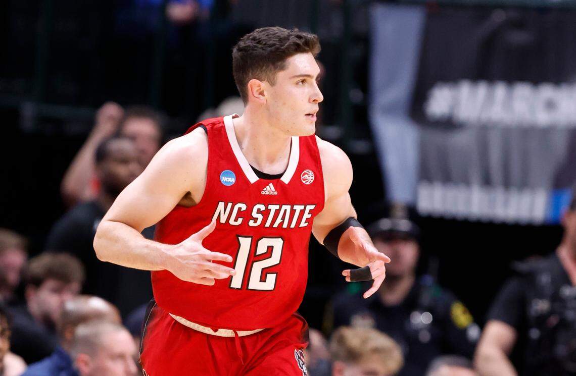 N.C. State’s Michael O’Connell (12) celebrates hitting a three-pointer during the first half of N.C. State’s game against Marquette in their NCAA Tournament Sweet 16 game at the American Airlines Center in Dallas, Texas, Friday, March 29, 2024.