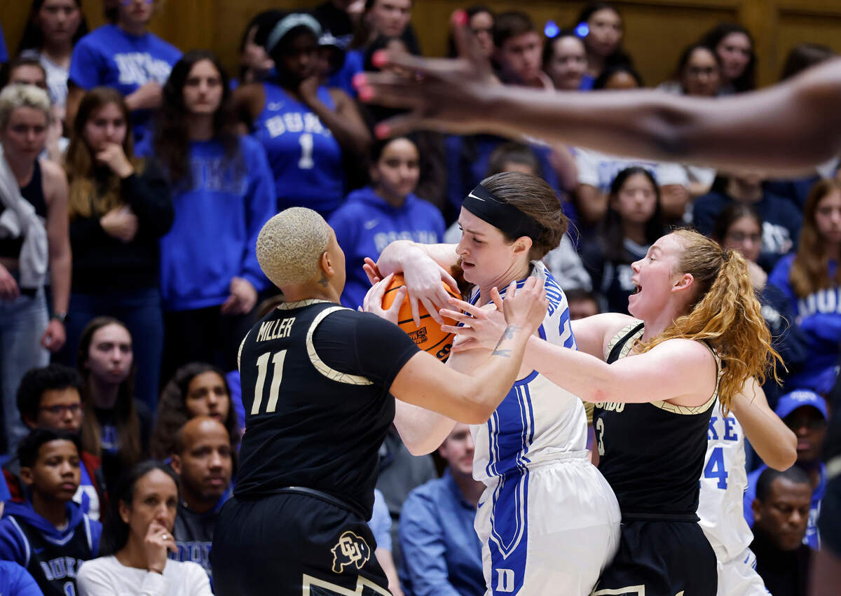 Duke’s Kennedy Brown is pressured by Colorado’s Quay Miller and Frida Formann during the second half of the Blue Devils’ 61-53 loss to Colorado in an NCAA Tournament second round game at Cameron Indoor Stadium on Monday, March 20, 2023, in Durham, N.C.