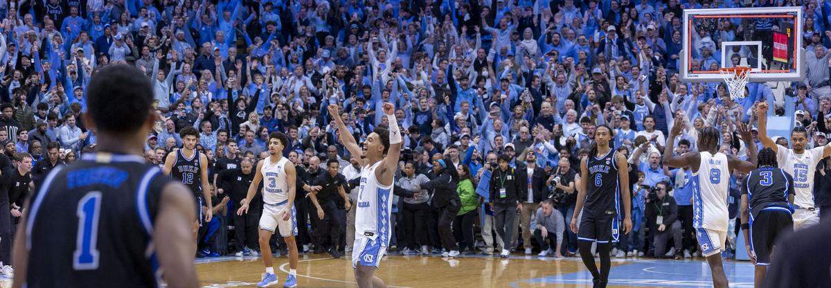 After clearing the court and allowing Duke one final shot with .4 seconds to play, North Carolina guard Seth Trimble (7) and his teammate celebrate their 71-68 victory over Duke on Saturday, February 7, 2026 at the Smith Center in Chapel Hill, N.C.