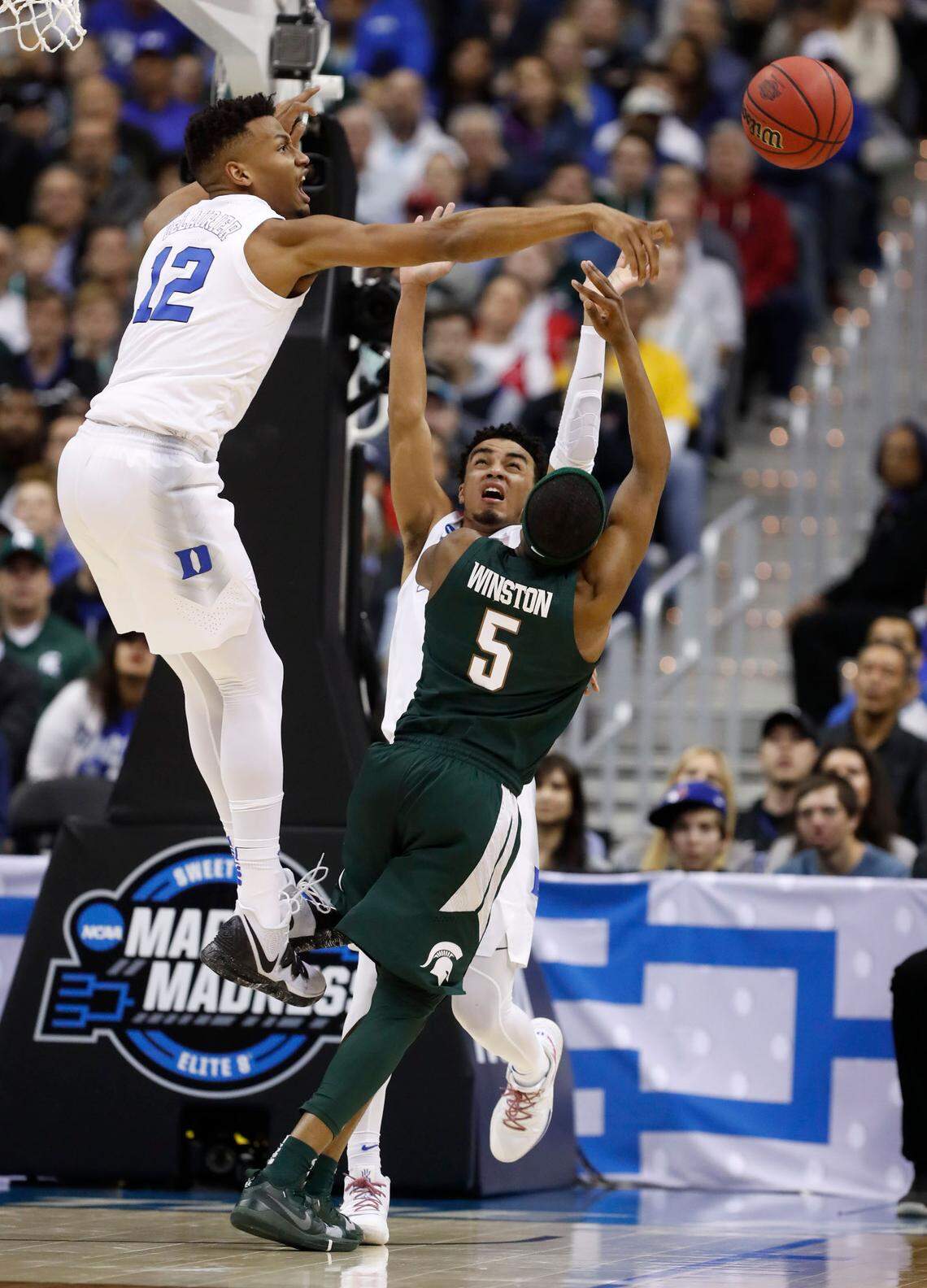 Duke’s Javin DeLaurier (12) blocks the shot by Michigan State’s Cassius Winston (5) during the second half of Michigan State’s 68-67 victory over Duke in their NCAA Elite 8 game in Washington, D.C., Sunday, March 31, 2019.