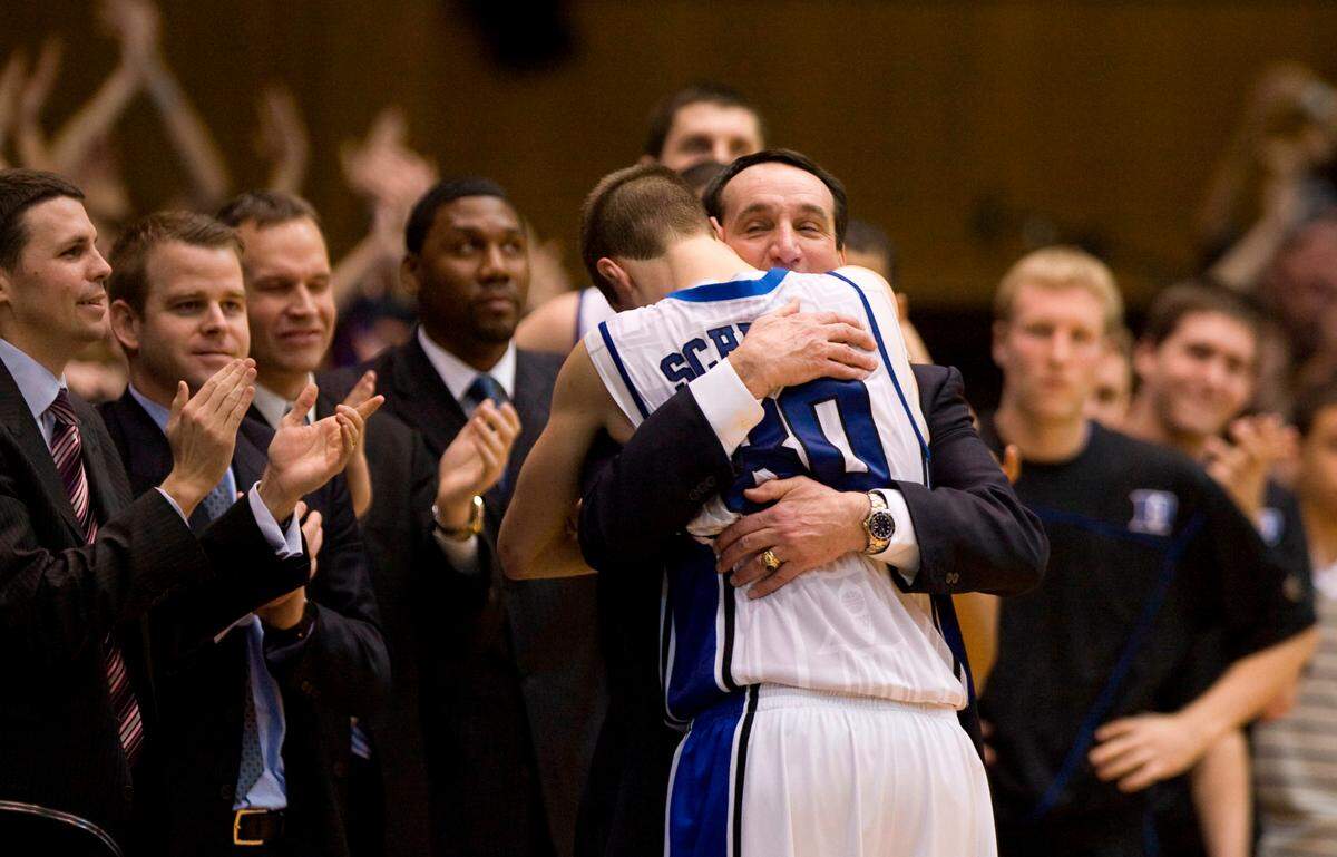 Duke senior Jon Scheyer gets a hug from coach Mike Krzyzewski after scoring 20 points in Duke’s 82-50 win over Carolina in 2010. PHOTOS BY CHUCK LIDDY - cliddy@newsobserver.com