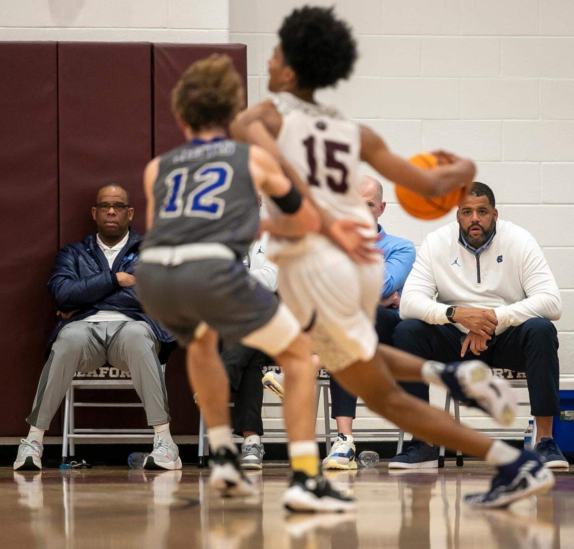 University of North Carolina coaches Hubert Davis, Brad Frederick and Sean May watch Jarin Stevenson (15) play during a victory over Jordan-Matthews on January 31, 2023 in Pittsboro, N.C.  Hubert Davis brought all of his assistant coaches with him to watch Stevenson play as they recruit him. 