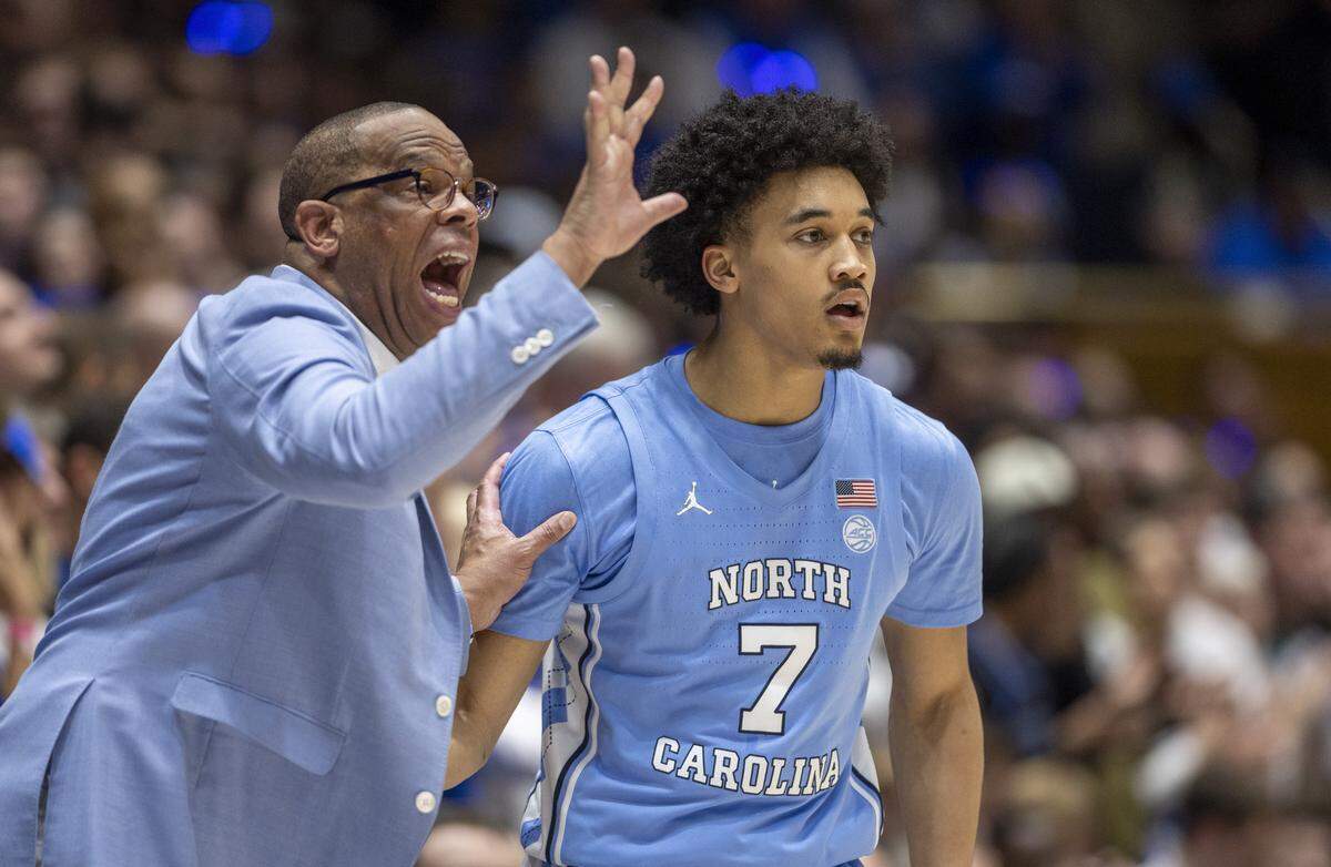 North Carolina coach Hubert Davis directs Seth Trimble (7) and his team during the first half against Duke on Saturday, March 9, 2024 at Cameron Indoor Stadium in Durham, N.C.