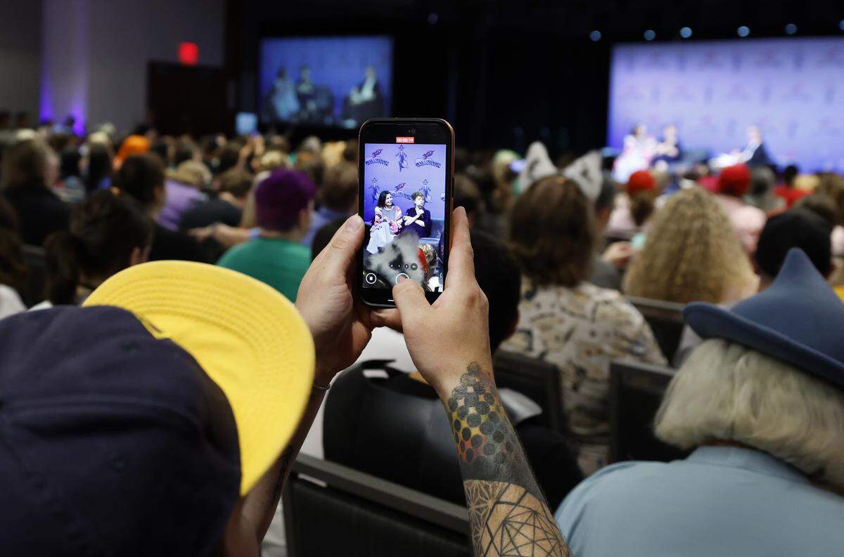 A fan records as Geena Davis and Susan Sarandon appear during a “Q&A with Thelma and Louise” at GalaxyCon Raleigh at the Raleigh Convention Center Saturday, July 26, 2025.