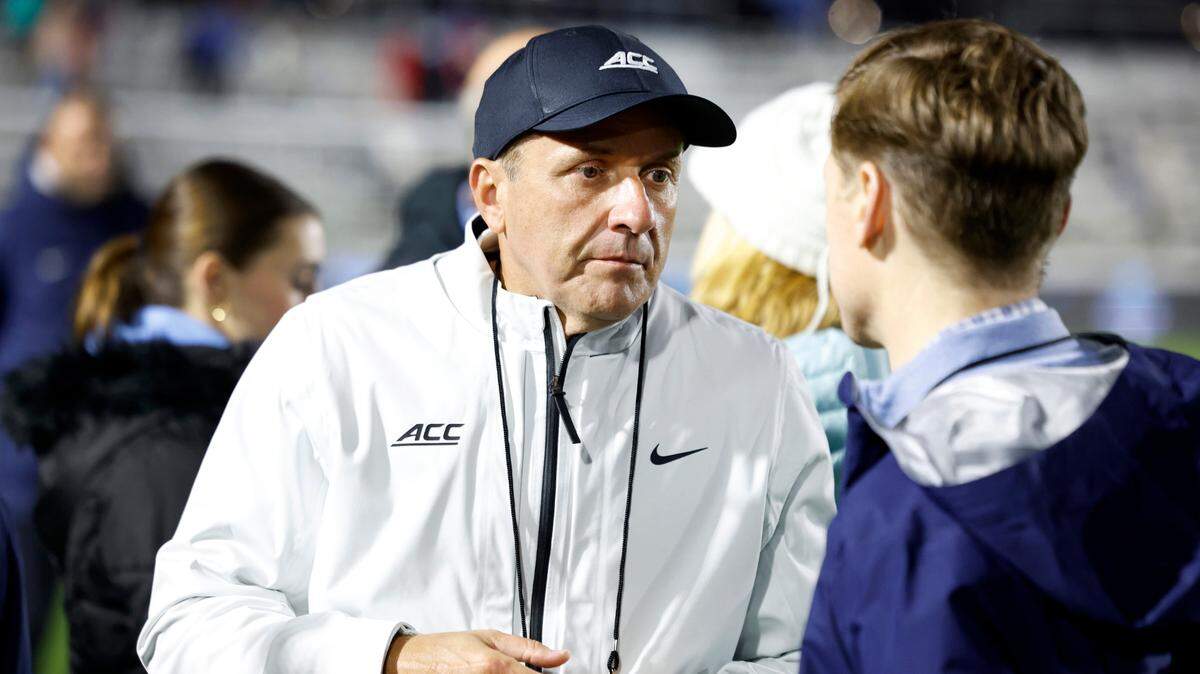 ACC Commissioner Jim Phillips talks with UNC Chancellor Lee Roberts after North Carolina’s 1-0 victory over Wake Forest in the finals of the 2024 Women’s College Cup at WakeMed Soccer Park in Cary, N.C., Monday, Dec. 9, 2024.