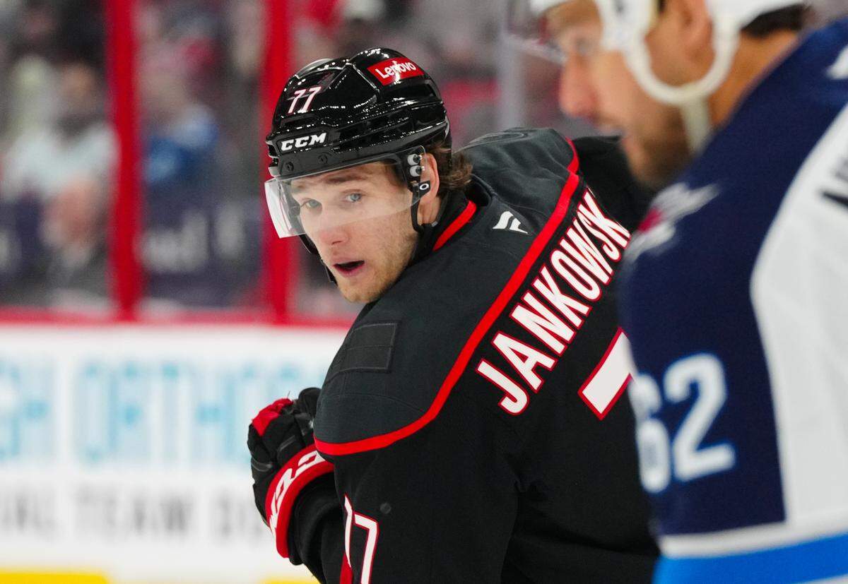 Mar 9, 2025; Raleigh, North Carolina, USA; Carolina Hurricanes center Mark Jankowski (77) skates against the Winnipeg Jets during the third period at Lenovo Center. James Guillory-Imagn Images