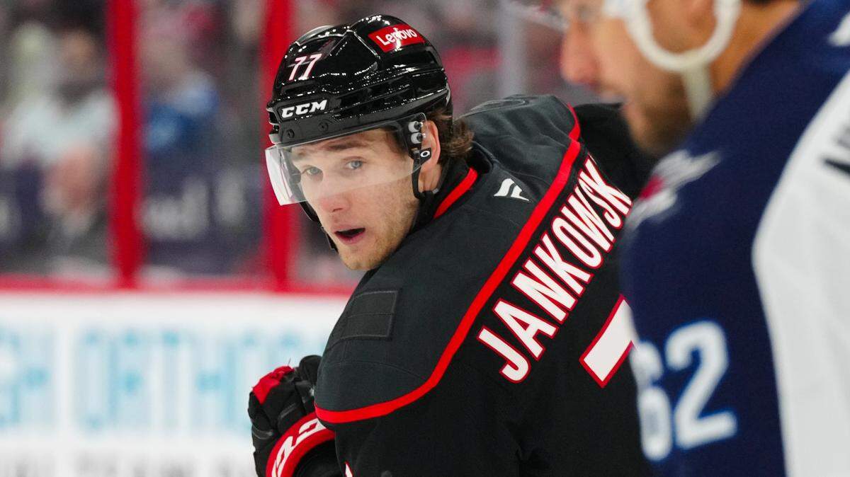 Mar 9, 2025; Raleigh, North Carolina, USA; Carolina Hurricanes center Mark Jankowski (77) skates against the Winnipeg Jets during the third period at Lenovo Center. James Guillory-Imagn Images