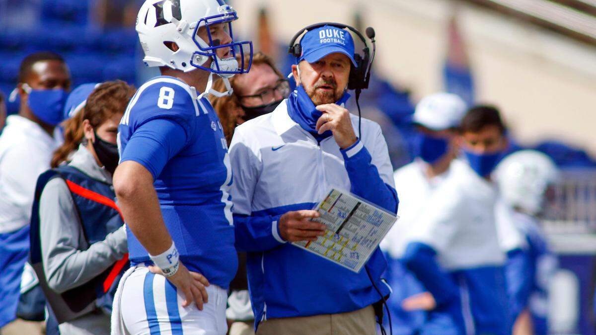 Duke head coach David Cutcliffe talks to quarterback Chase Brice after Brice threw an interception against Boston College during the second half of an NCAA college football game, Saturday, Sept. 19, 2020, in Durham, N.C. (Nell Redmond/Pool Photo via AP)